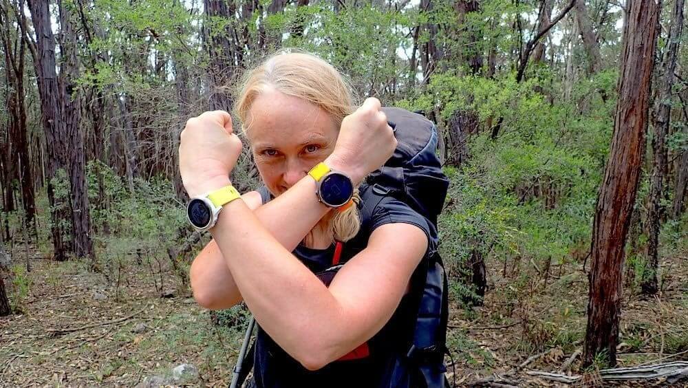 girl wearing garmin fenix 5S in forest