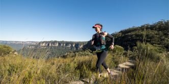 Woman trailrunning in the Australia bush